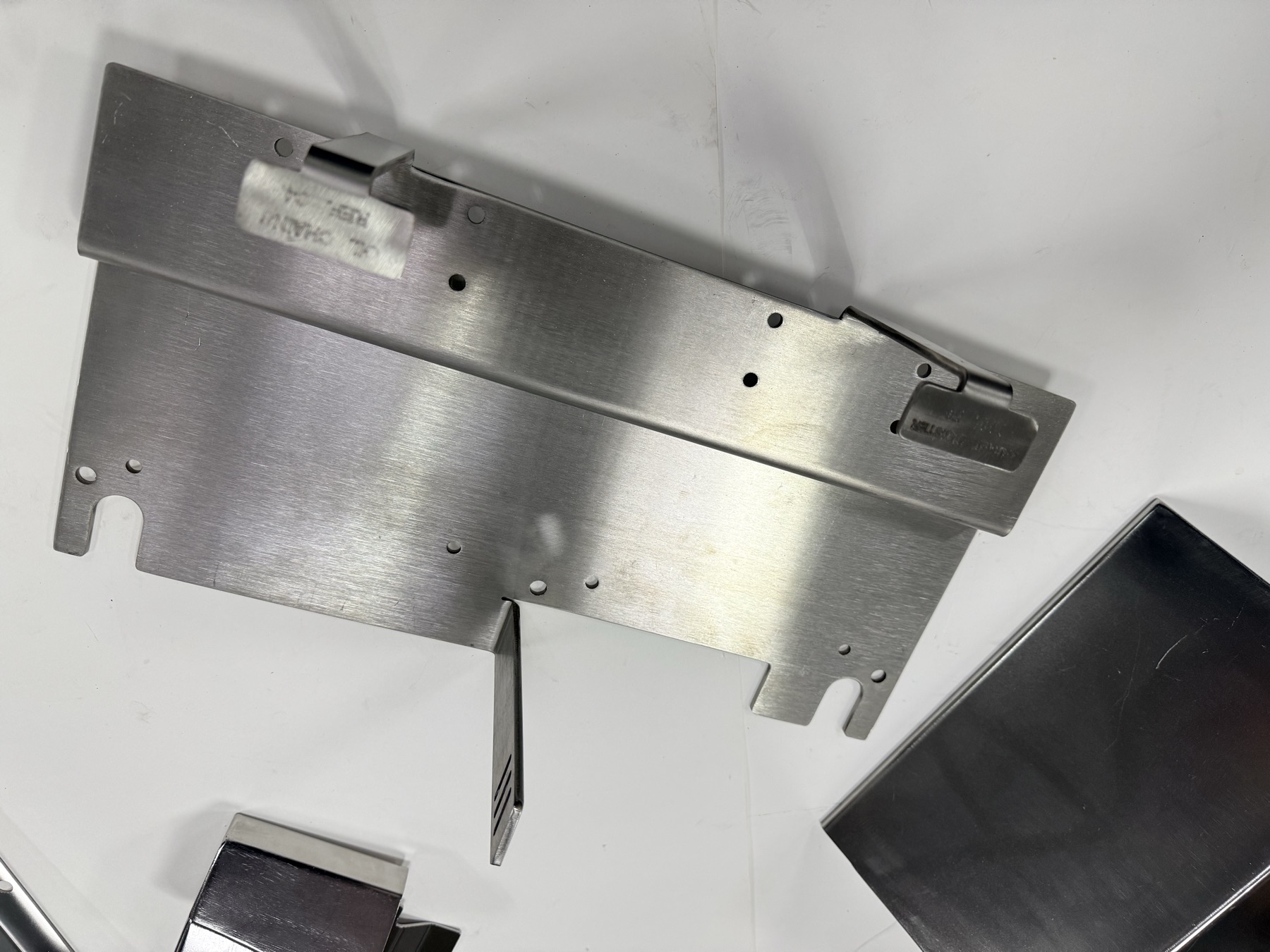 Bent sheet metal assembly with functional features