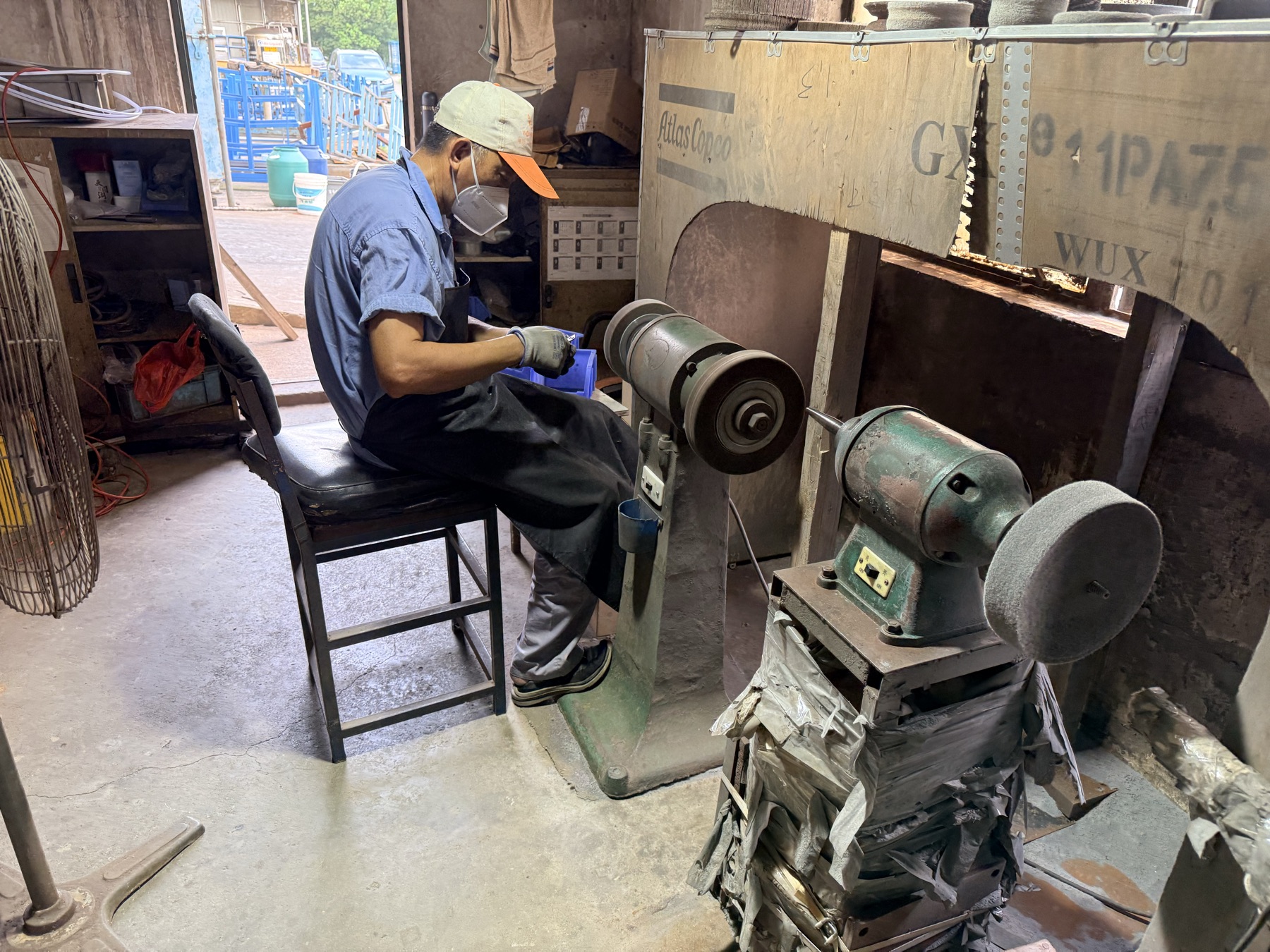 Operator polishing and grinding a fabricated component