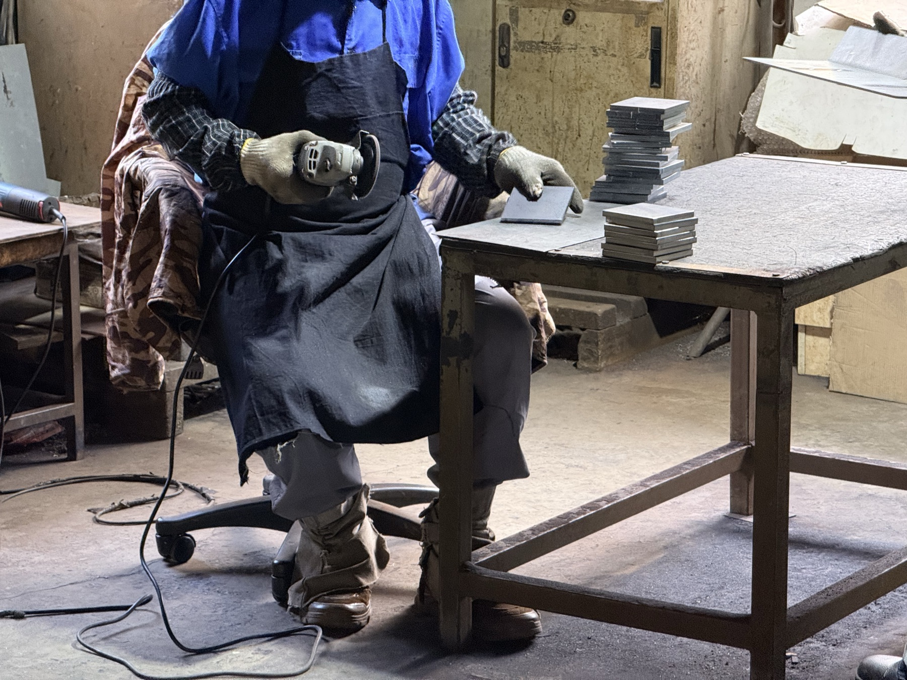 Operator welding a sheet metal assembly